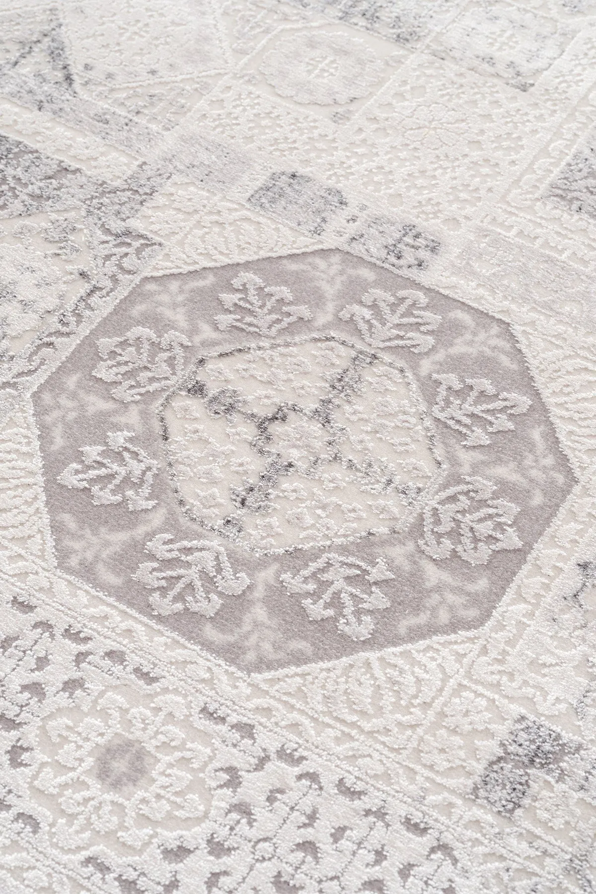 Grey carpet with traditional motifs.